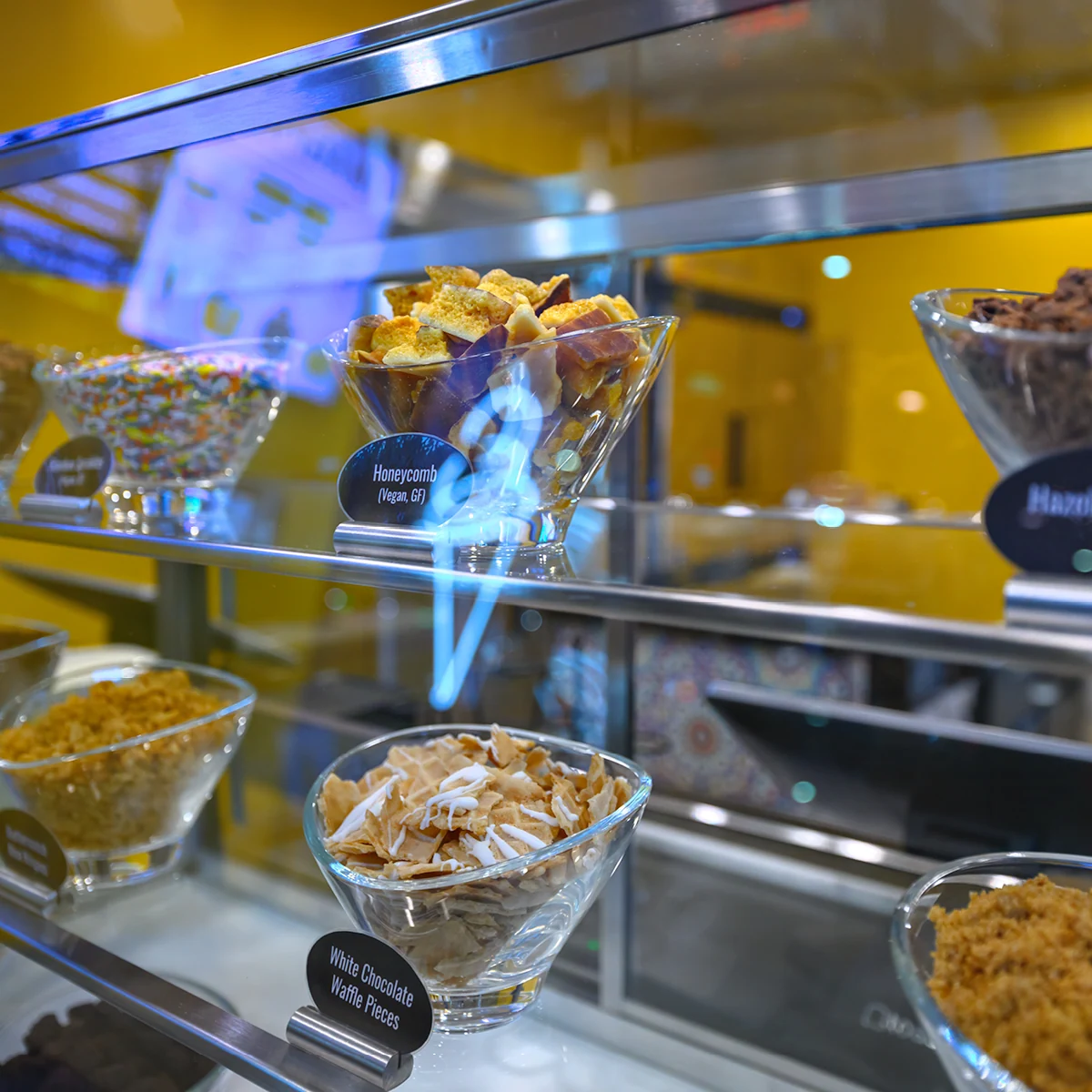 Bowls of handmade toppings displayed at the Magpies counter