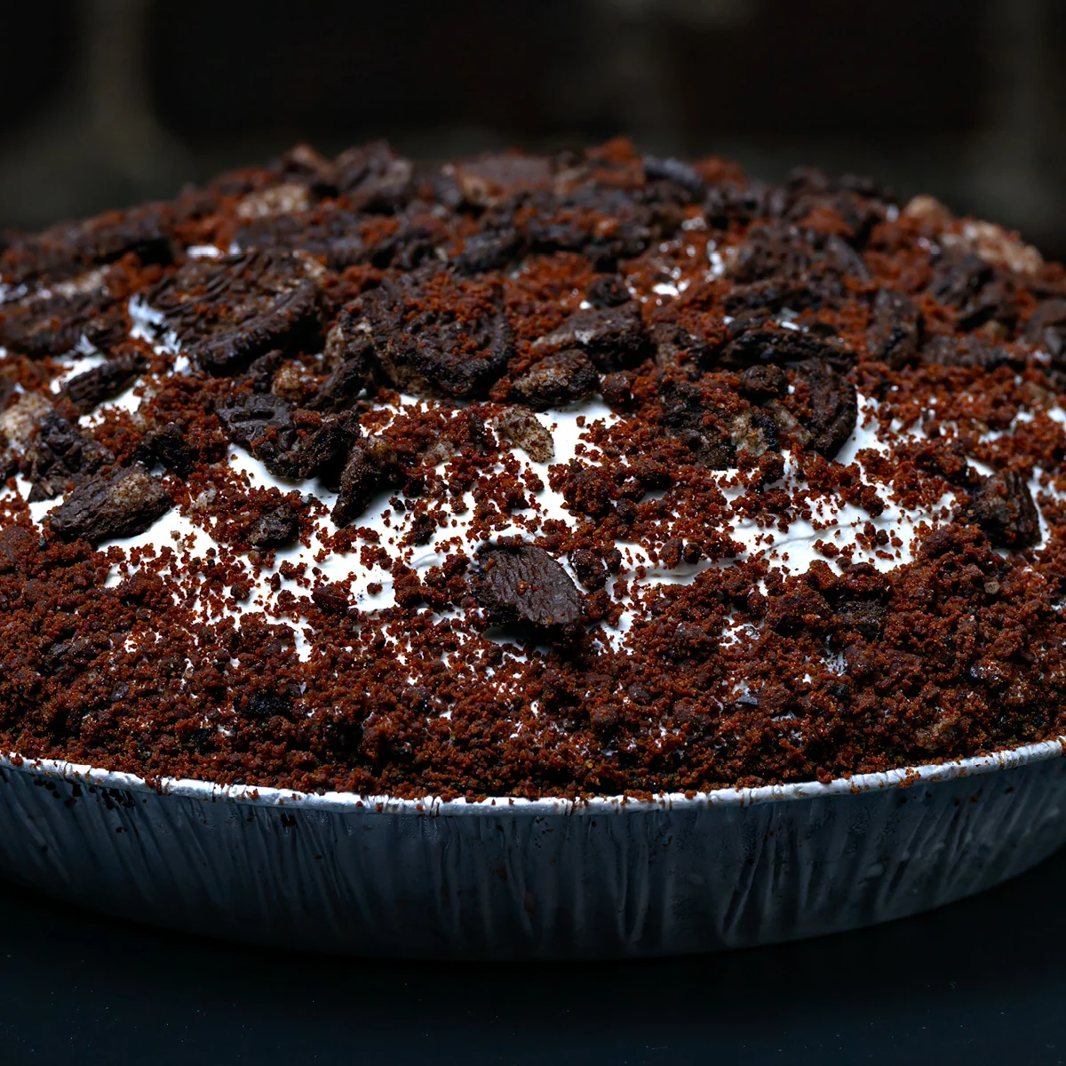 Whole Softserve Pie covered with chocolate cookie pieces and crumbs